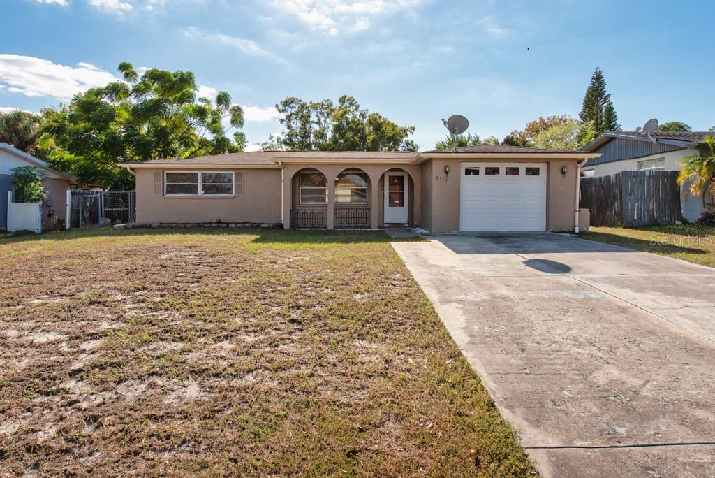 5117 School Road New Port Richey, FL 34653 - Photo 24 of 24 a front view of a house with garden