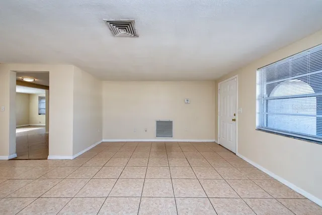 a view of an empty room and window