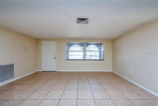 an empty room with windows