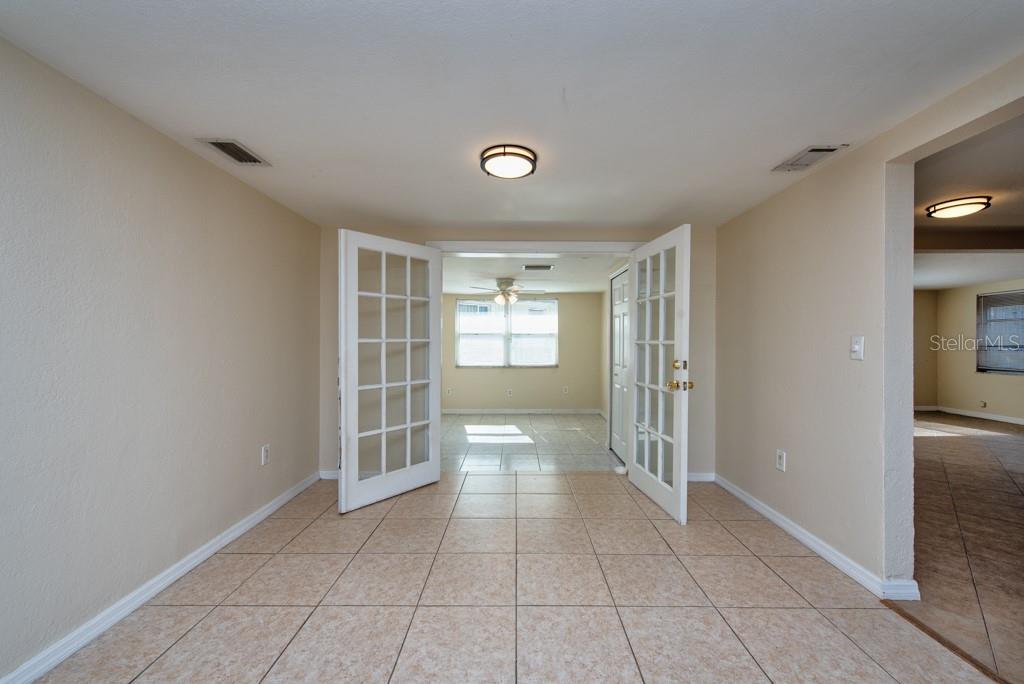 5117 School Road New Port Richey, FL 34653 - Photo 5 of 24 a view of an empty room with a window