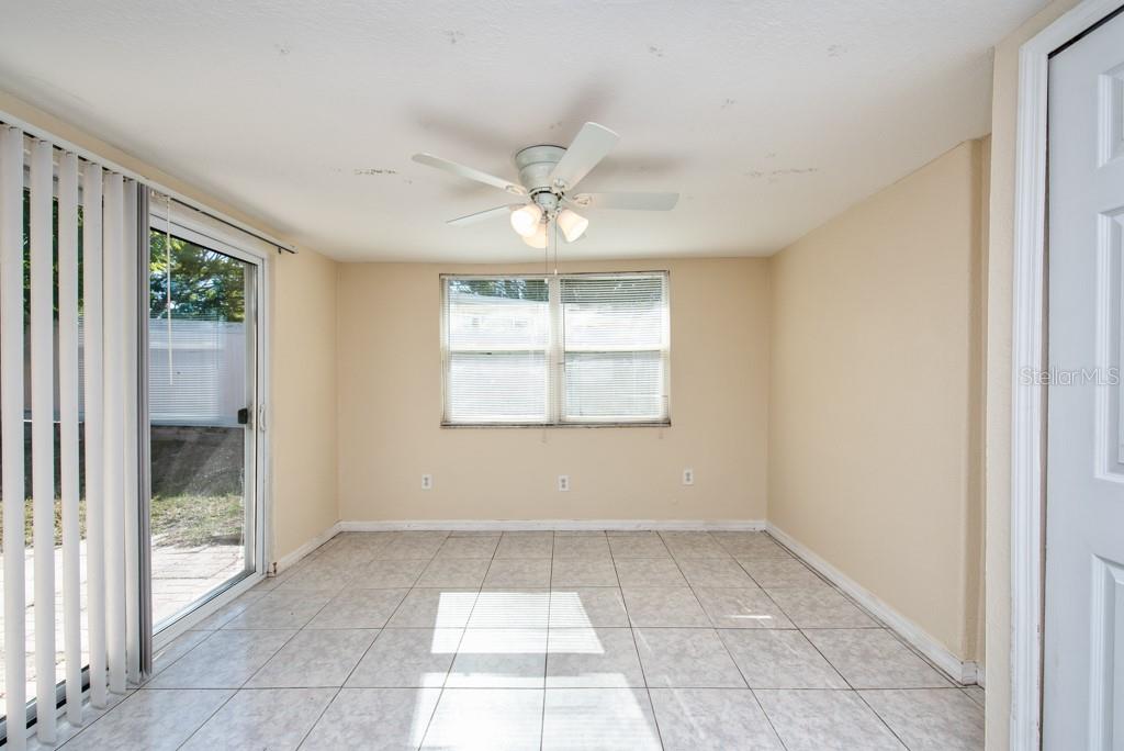 5117 School Road New Port Richey, FL 34653 - Photo 6 of 24 a view of an empty room with a window