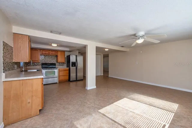 a view of kitchen with sink and cabinet