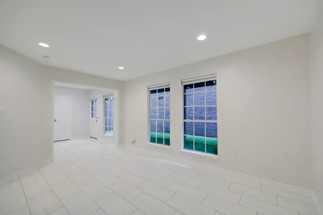 a bathroom with a toilet sink vanity tub and shower