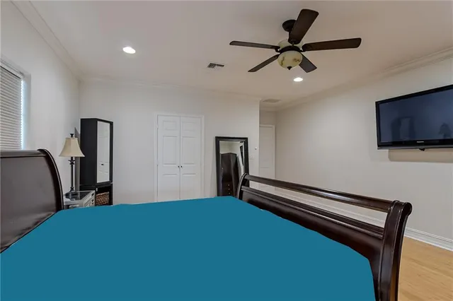 a bedroom with bed and tv