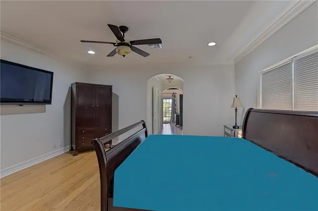 a bed room with a bed and a television