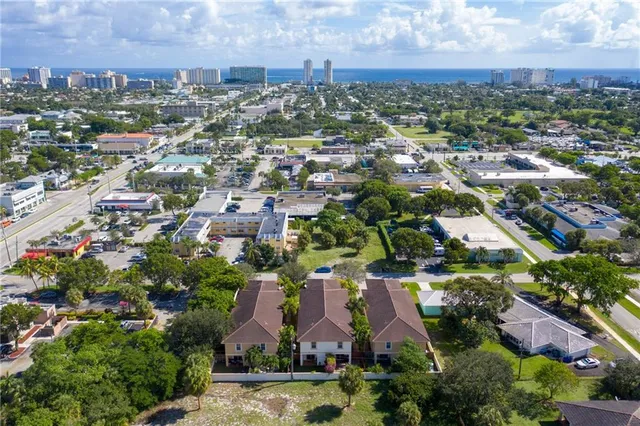 an aerial view of residential houses with outdoor space