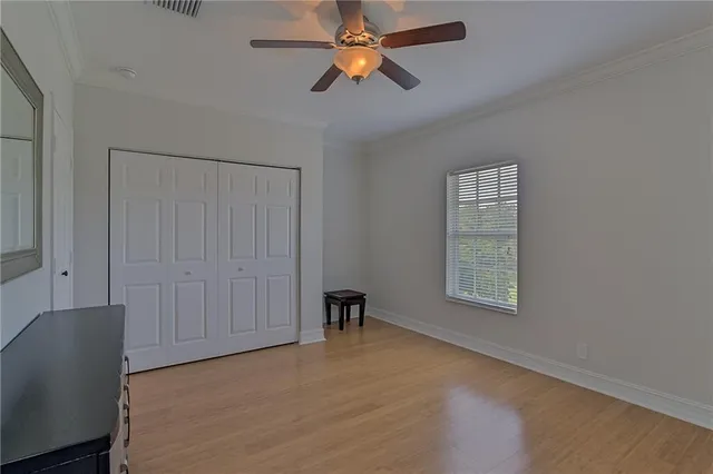 a view of room with window and a ceiling fan
