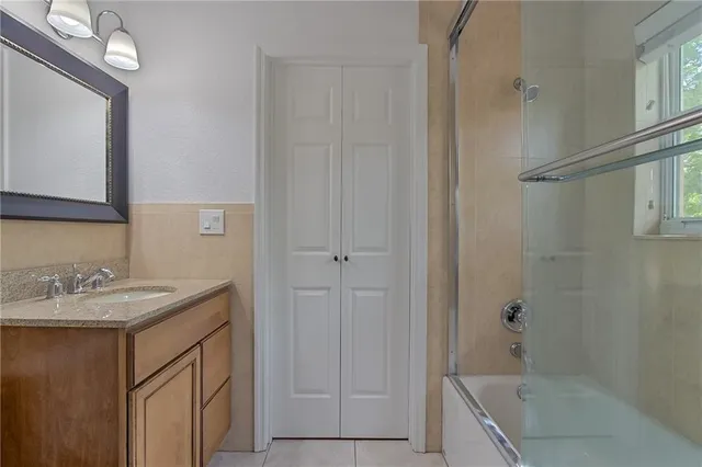 a bathroom with a sink a vanity and a mirror