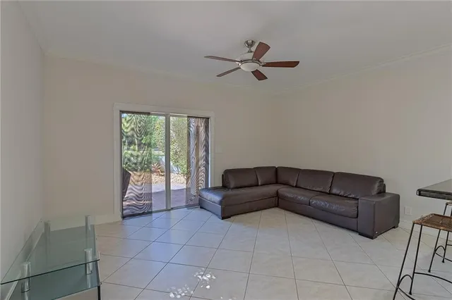 a living room with a couch and a window