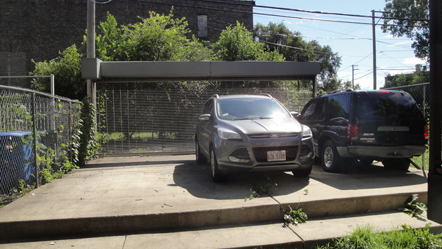 2807 West Jackson Boulevard, Unit 2 Chicago, IL 60612 - Photo 13 of 13 a side view of a house with a patio