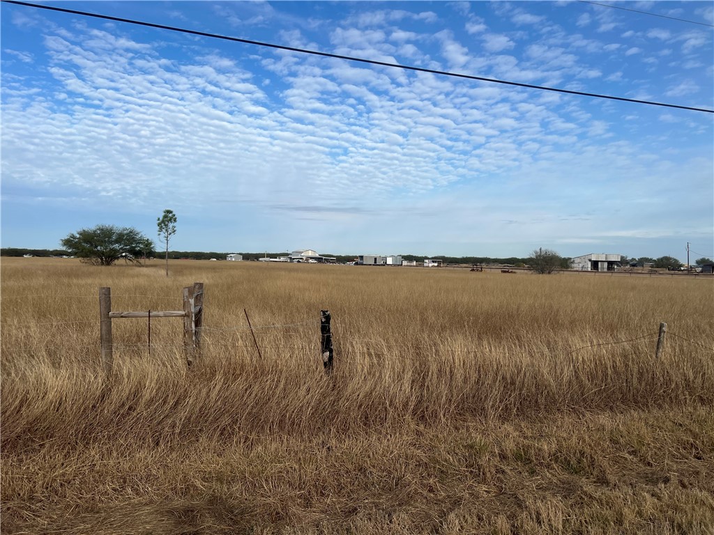 8051 Fm 1068 Mathis, TX 78368 - Photo 7 of 30 a view of a lake with houses in the back