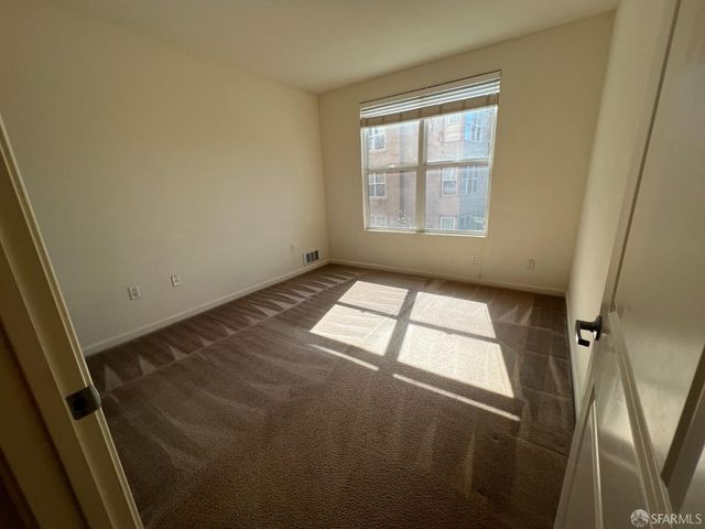 a view of an empty room and window