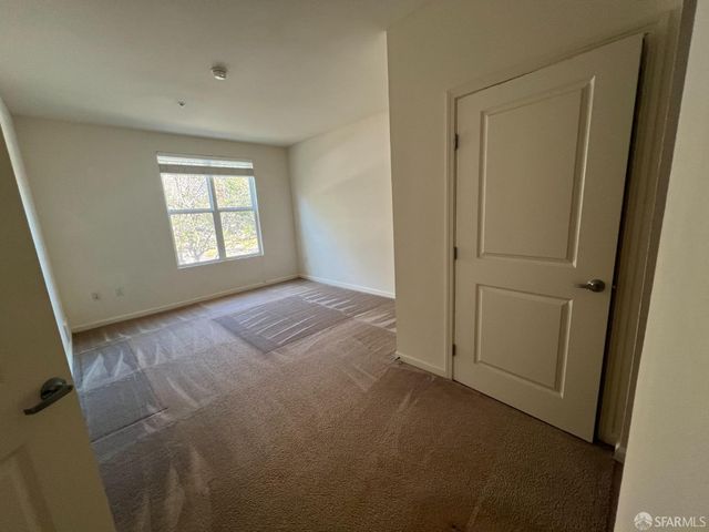 a view of empty room with windows