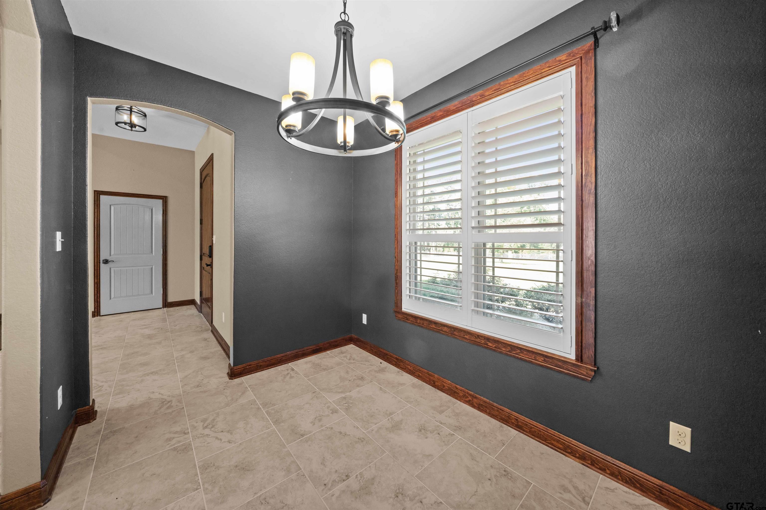 17153 County Road 1108 Flint, TX 75762 - Photo 14 of 45 a view of a livingroom with a ceiling fan and window