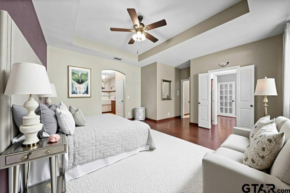 17153 County Road 1108 Flint, TX 75762 - Photo 15 of 45 a spacious bedroom with a bed and ceiling fan