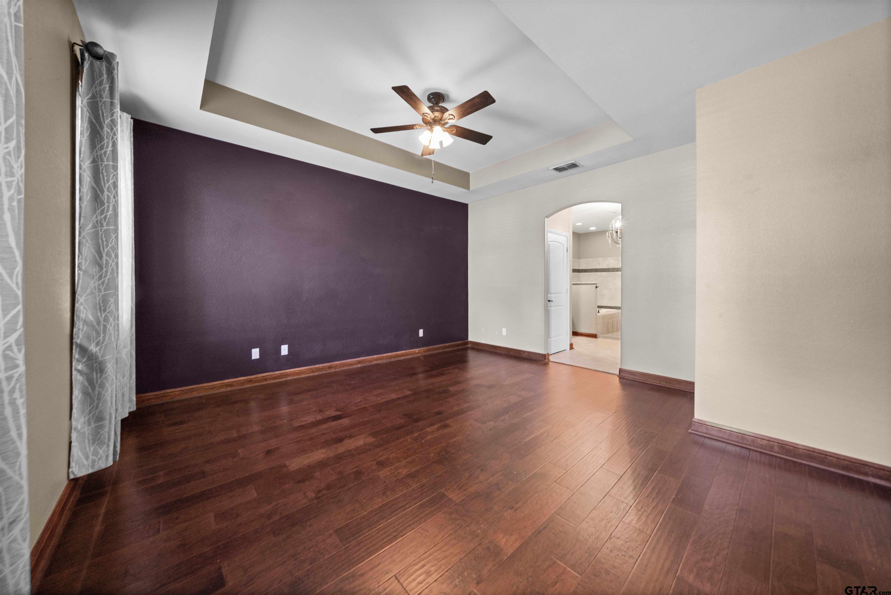 17153 County Road 1108 Flint, TX 75762 - Photo 17 of 45 a view of a livingroom with a ceiling fan wooden floor and window