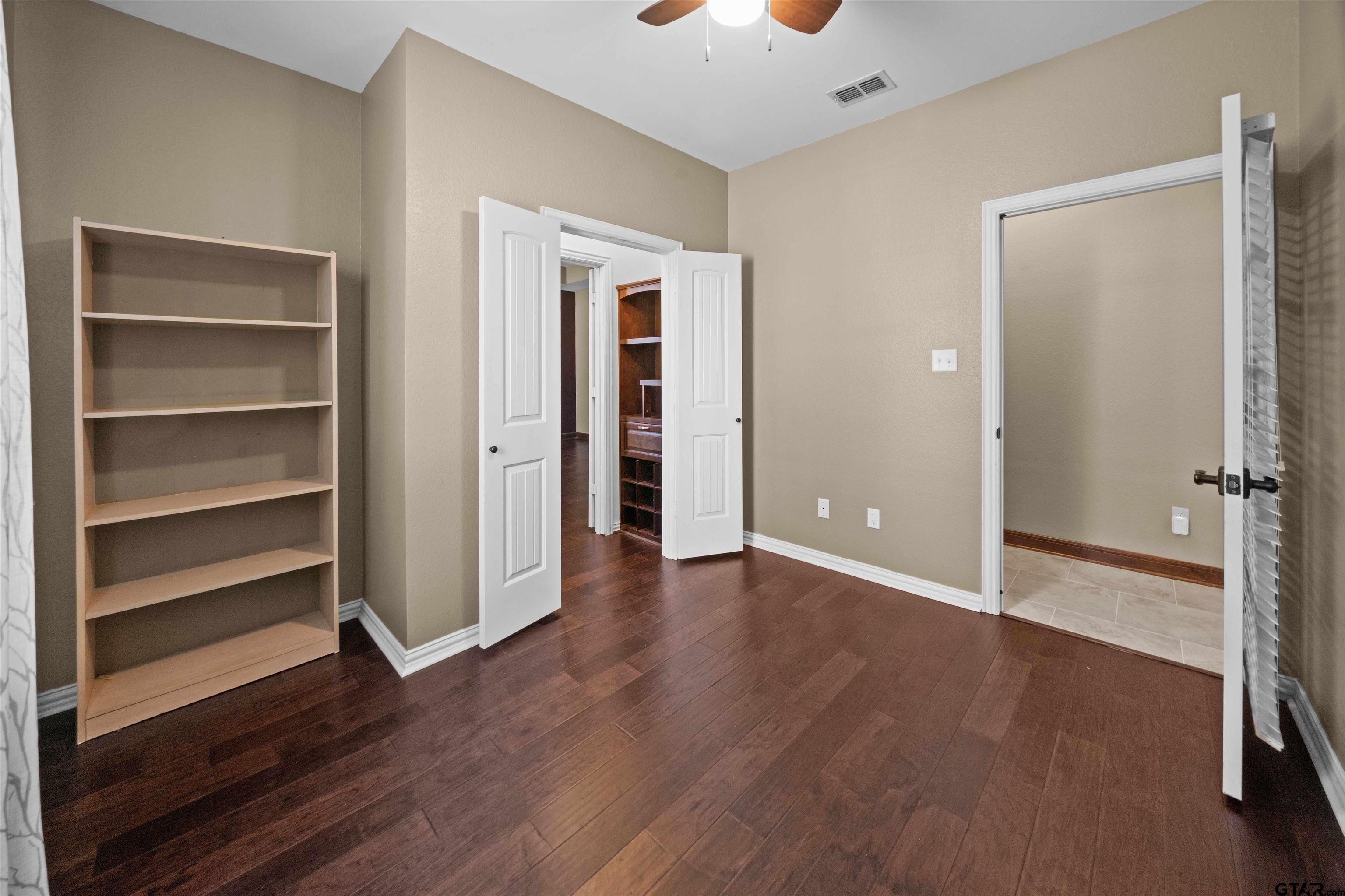 17153 County Road 1108 Flint, TX 75762 - Photo 19 of 45 a view of an empty room with a window and wooden floor
