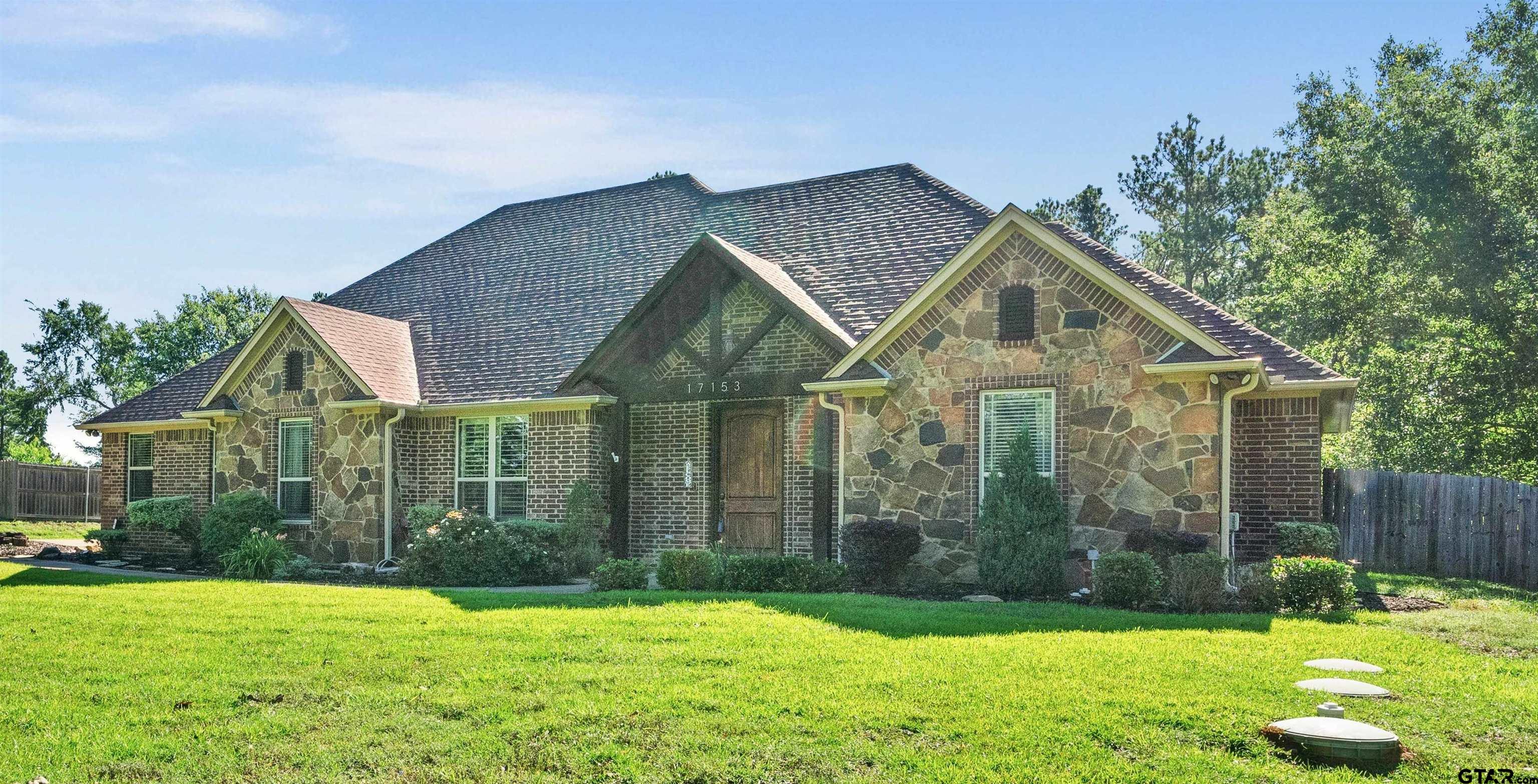 17153 County Road 1108 Flint, TX 75762 - Photo 2 of 45 a front view of a house with yard and green space