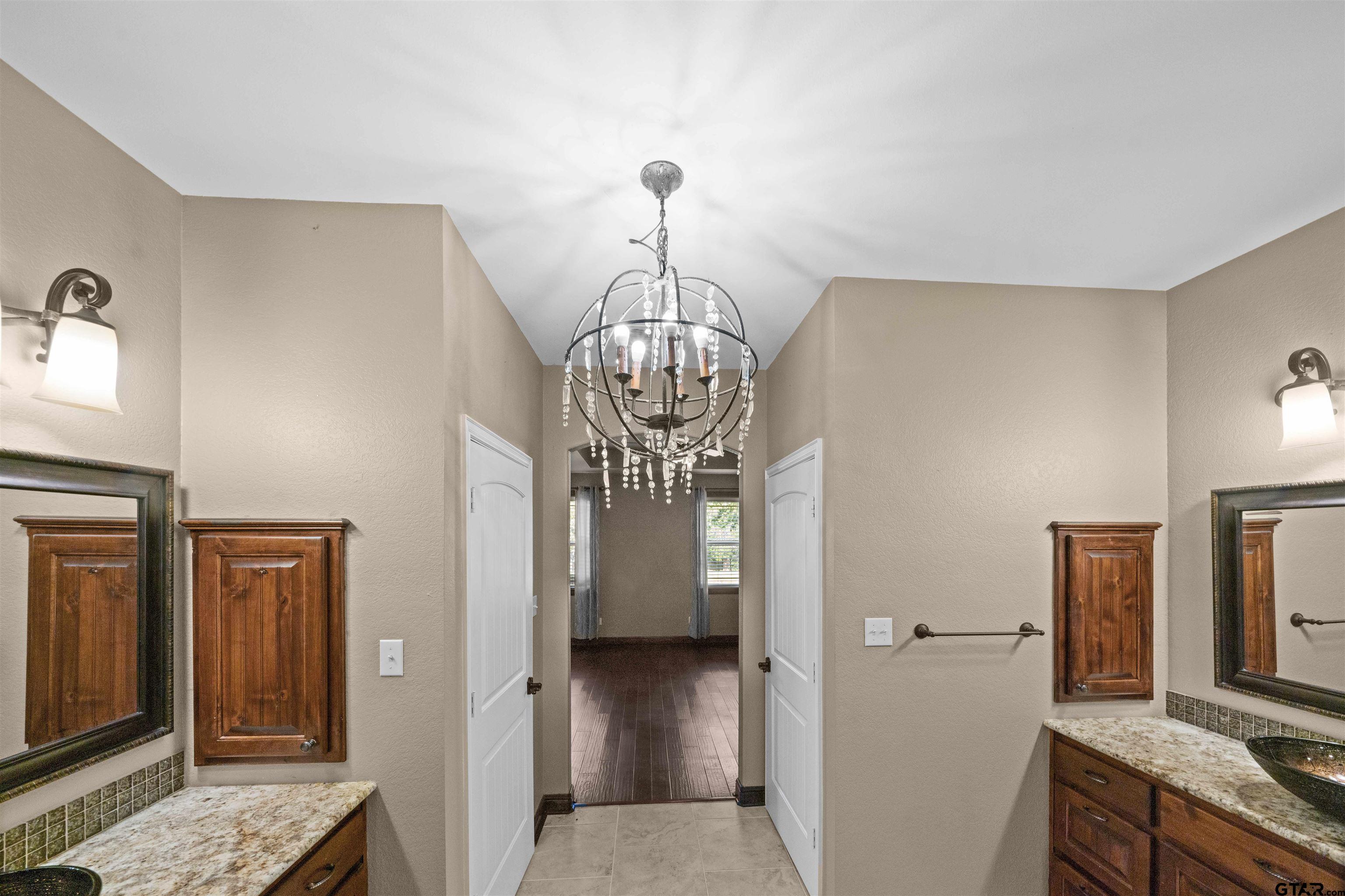 17153 County Road 1108 Flint, TX 75762 - Photo 21 of 45 a view of a hallway with wooden floor and staircase