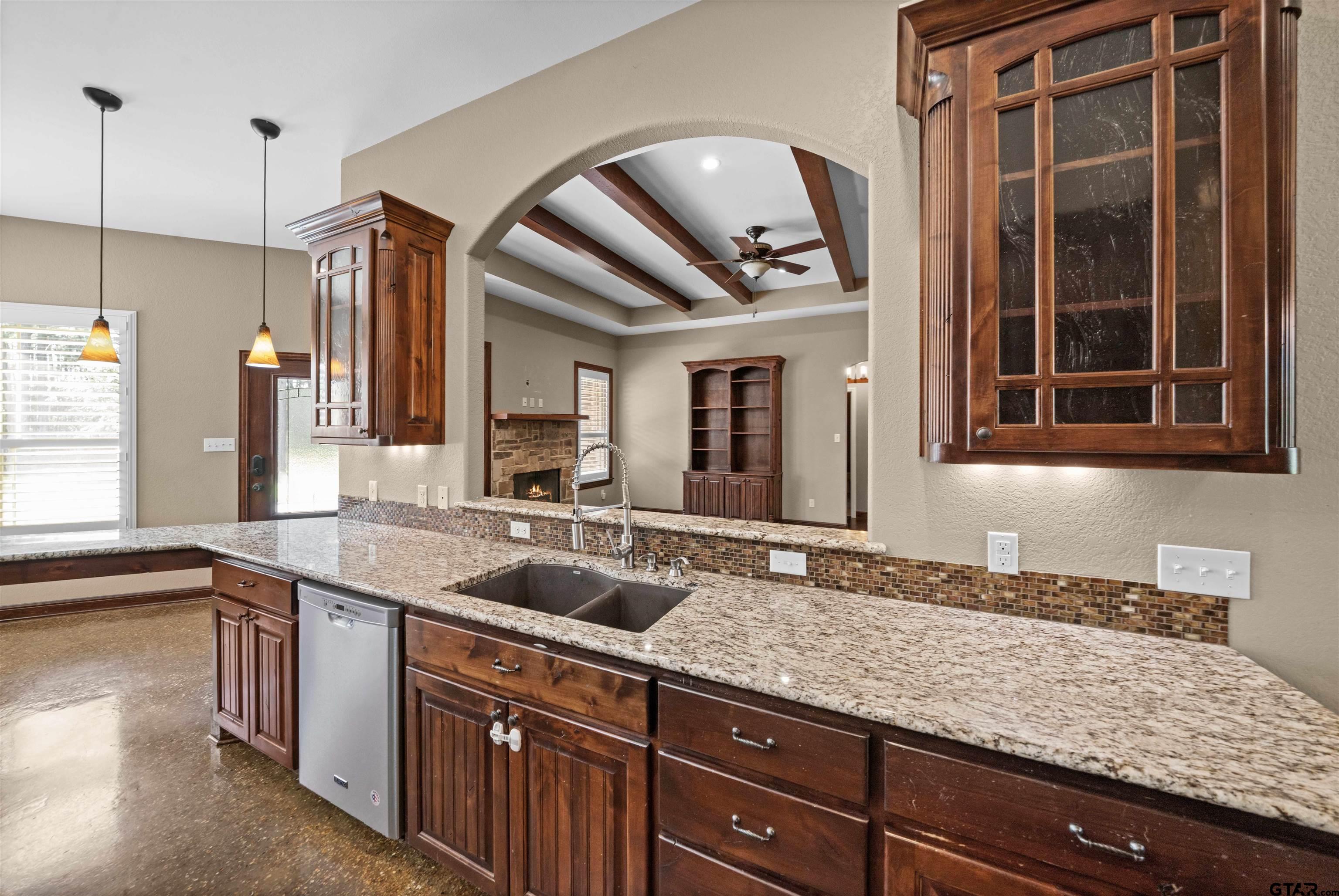17153 County Road 1108 Flint, TX 75762 - Photo 5 of 45 a kitchen with granite countertop a sink and a window