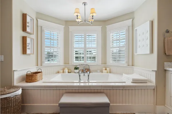 a living room with furniture and large windows