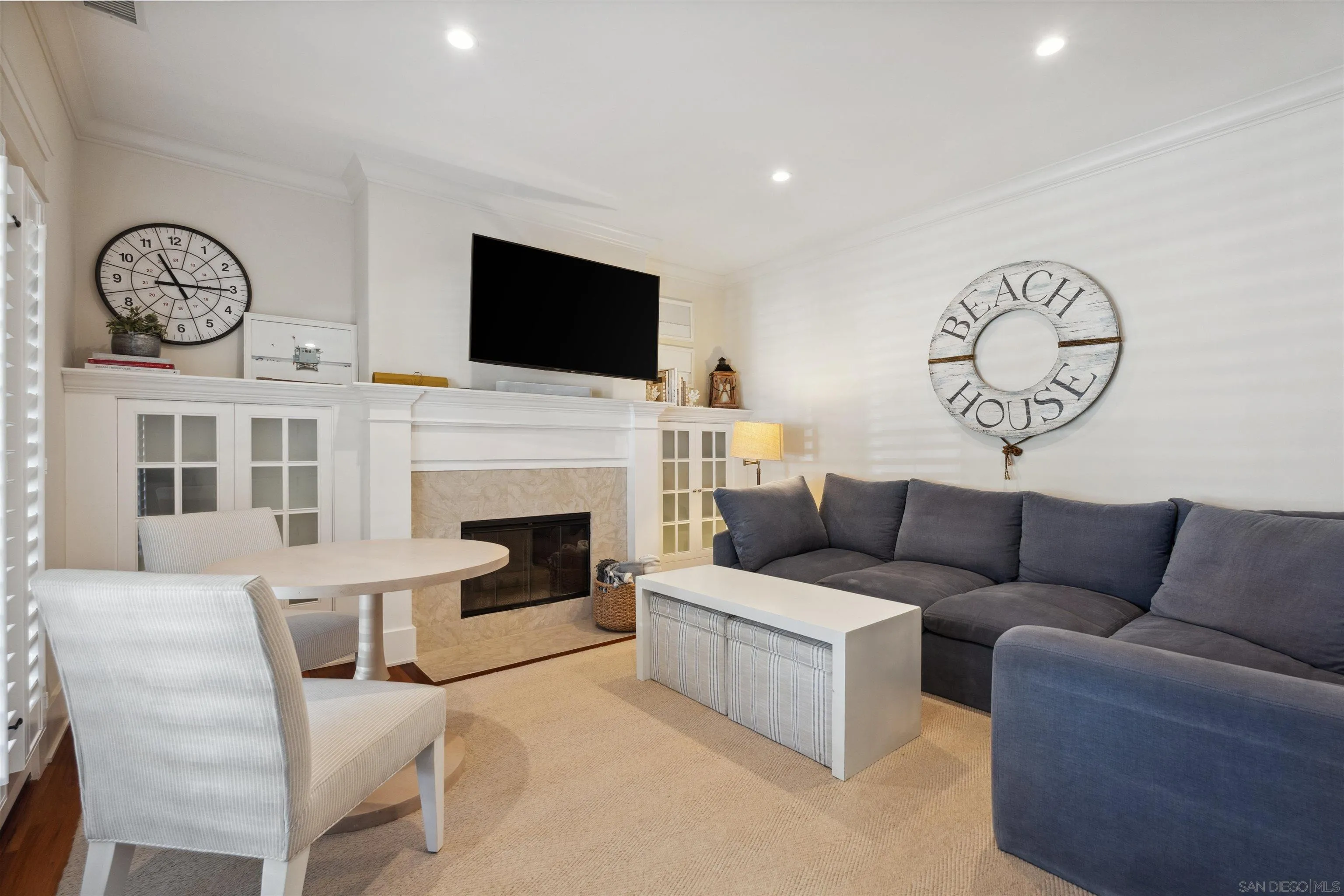 731 Balboa Avenue Coronado, CA 92118 - Photo 4 of 18 a living room with furniture a fireplace and a flat screen tv