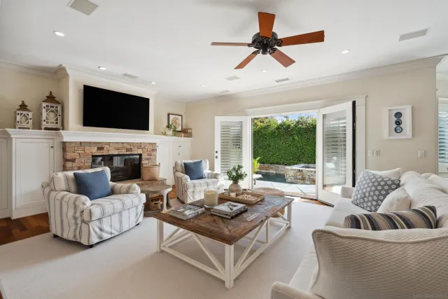 a living room with furniture fireplace and a flat screen tv