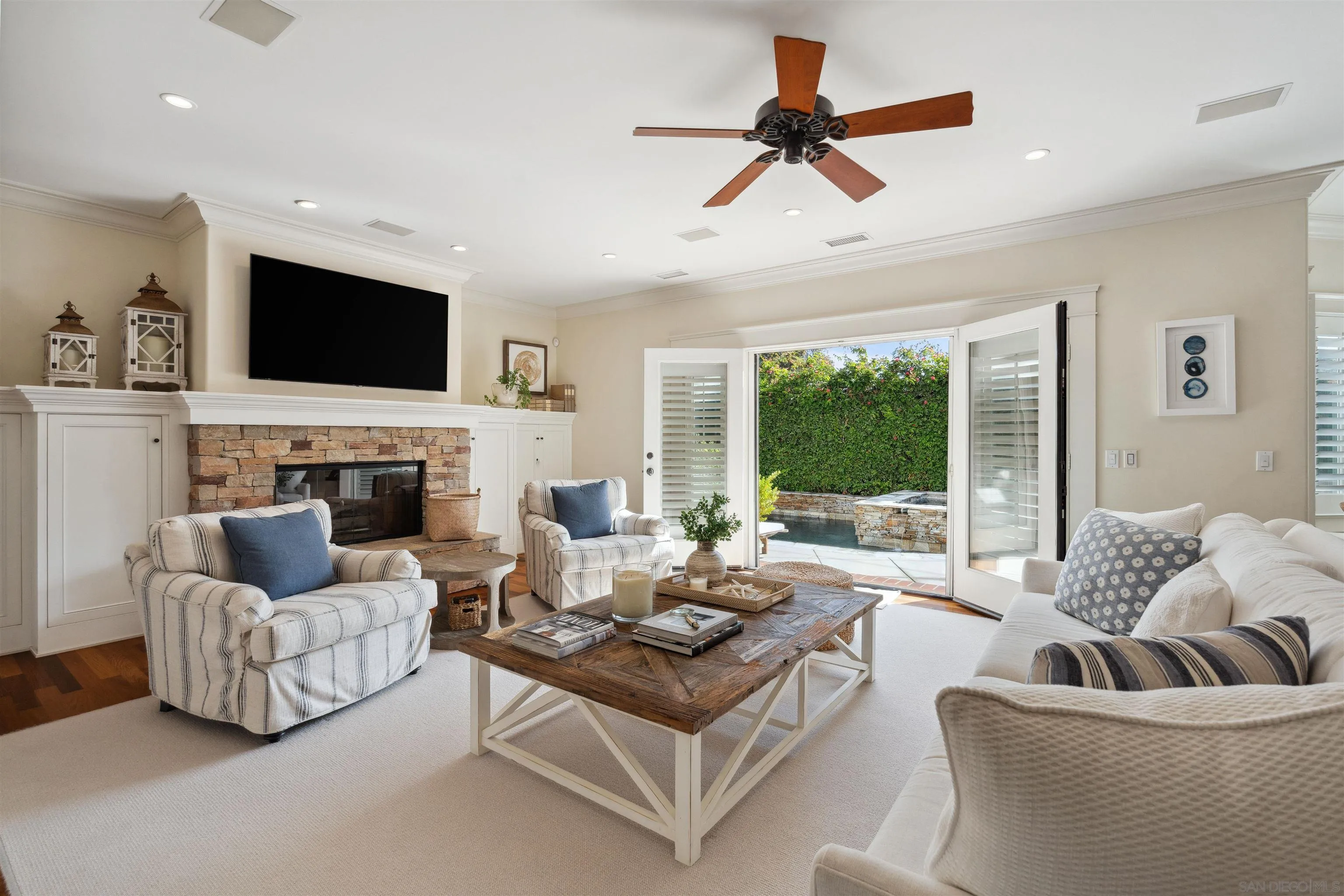 731 Balboa Avenue Coronado, CA 92118 - Photo 8 of 18 a living room with furniture fireplace and a flat screen tv