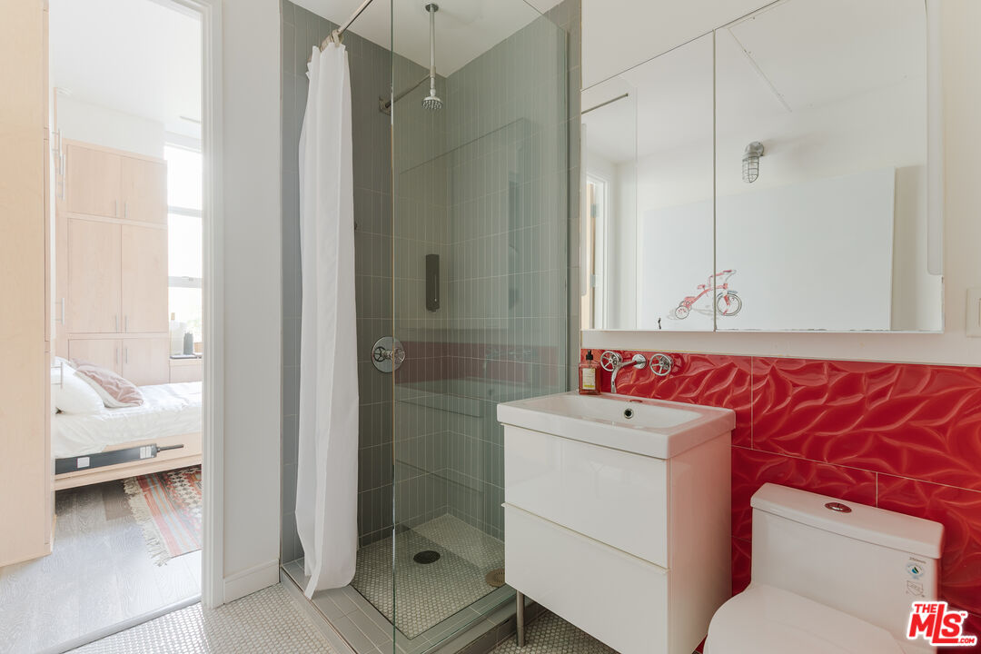 4080 Glencoe Avenue, Unit 219 Marina del Rey, CA 90292 - Photo 11 of 31 a bathroom with a sink toilet and shower