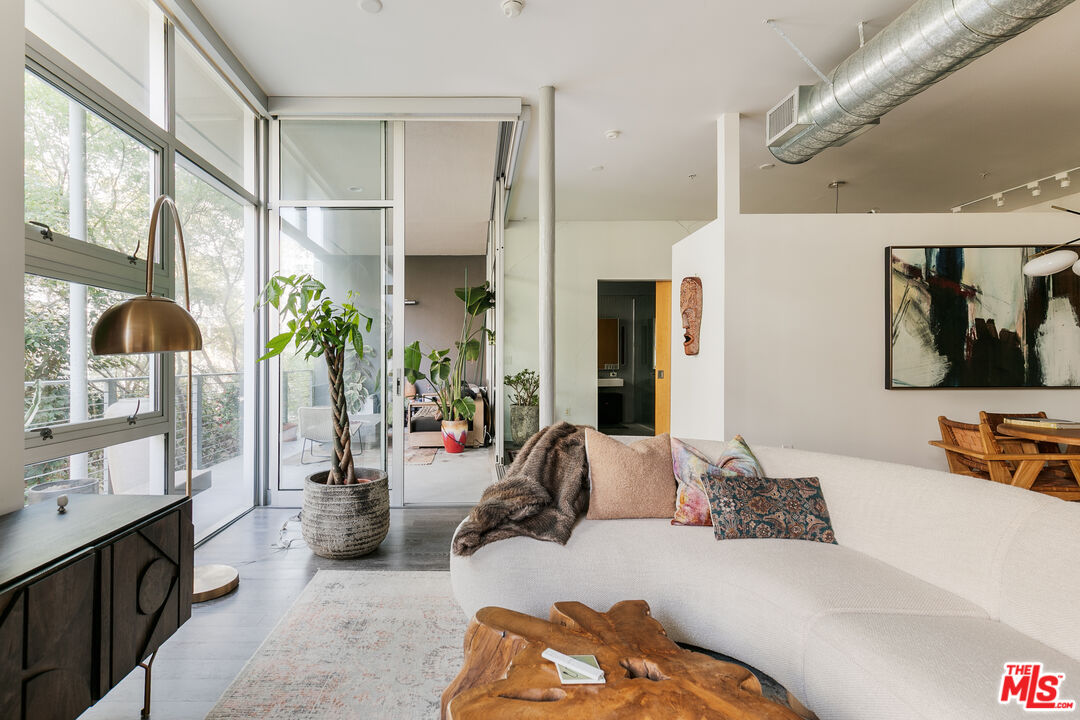 4080 Glencoe Avenue, Unit 219 Marina del Rey, CA 90292 - Photo 15 of 31 a bedroom with furniture and a flat screen tv