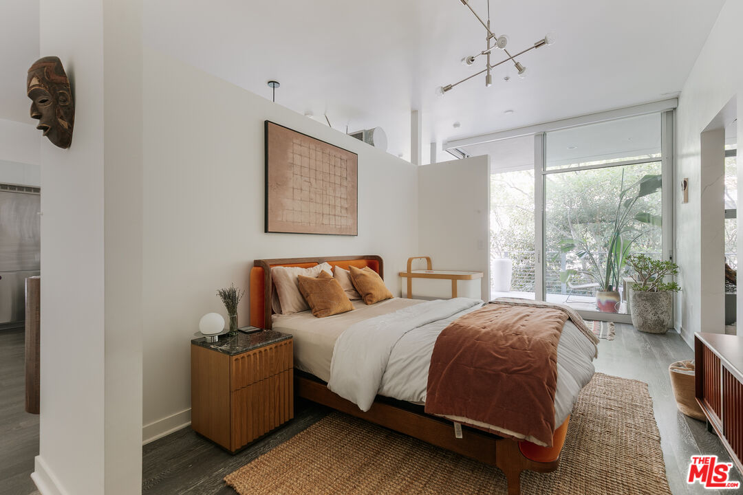 4080 Glencoe Avenue, Unit 219 Marina del Rey, CA 90292 - Photo 16 of 31 a bedroom with a bed and a large window