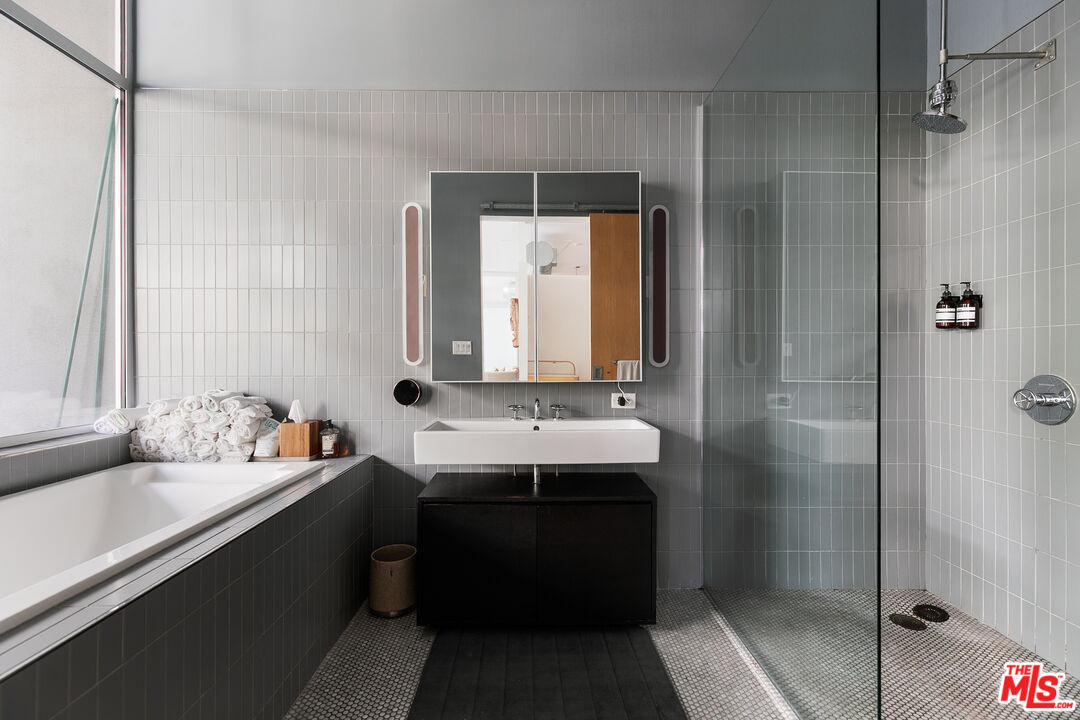 4080 Glencoe Avenue, Unit 219 Marina del Rey, CA 90292 - Photo 19 of 31 a bathroom with a sink and a mirror
