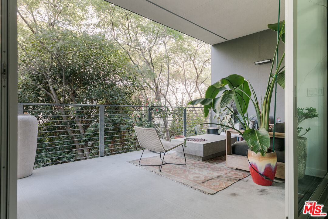 4080 Glencoe Avenue, Unit 219 Marina del Rey, CA 90292 - Photo 23 of 31 a view of a chair and table in the balcony