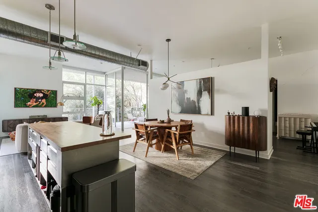 a very nice looking dining room with a large window