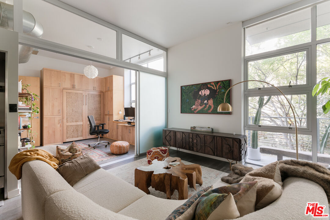 4080 Glencoe Avenue, Unit 219 Marina del Rey, CA 90292 - Photo 6 of 31 a living room with furniture large window and a chandelier