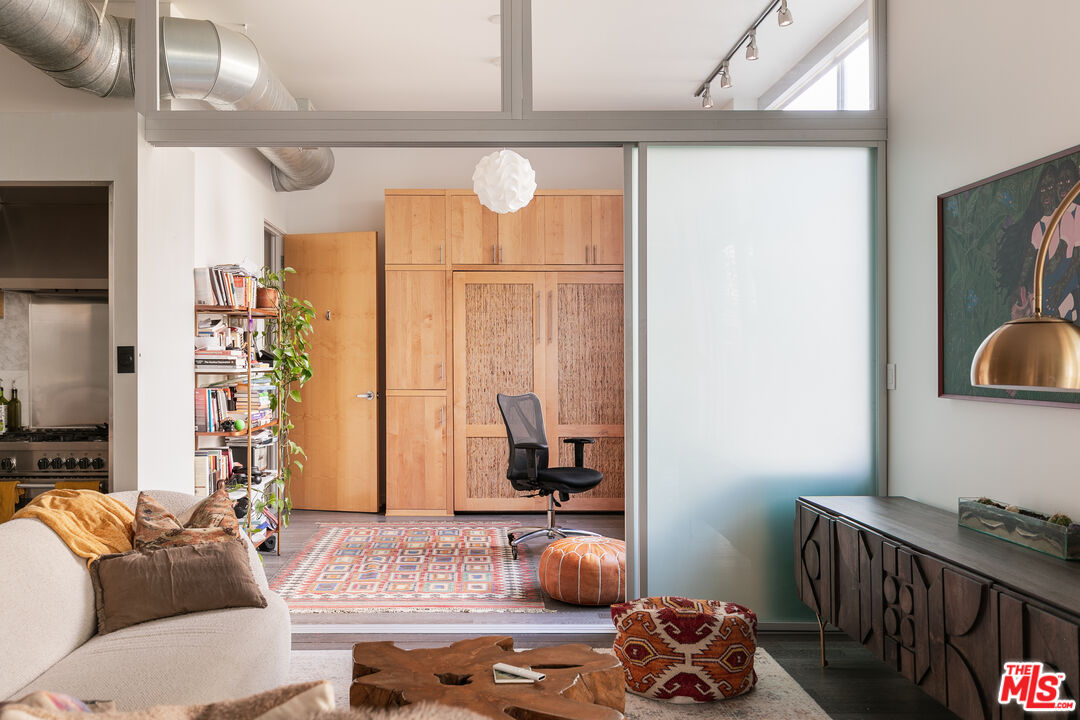 4080 Glencoe Avenue, Unit 219 Marina del Rey, CA 90292 - Photo 7 of 31 a living room with furniture and a window