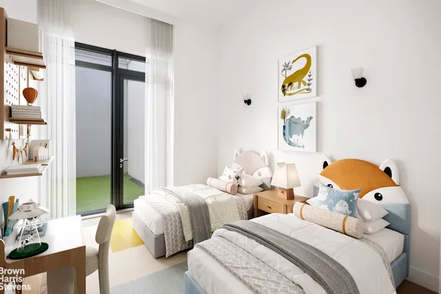 a bedroom with two beds and a window