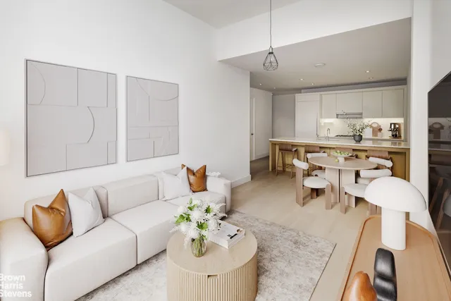 a kitchen with a sink and living room