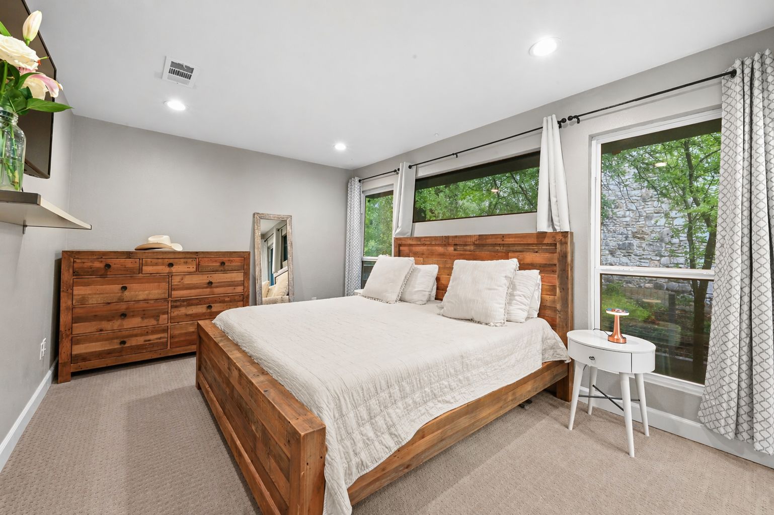 2101 Airole Way, Unit B Austin, TX 78704 - Photo 18 of 28 a large bedroom with a bed and window