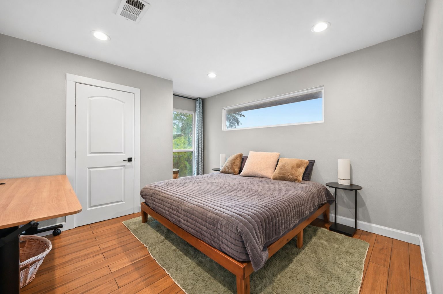 2101 Airole Way, Unit B Austin, TX 78704 - Photo 23 of 28 a bedroom with a bed and wooden floor