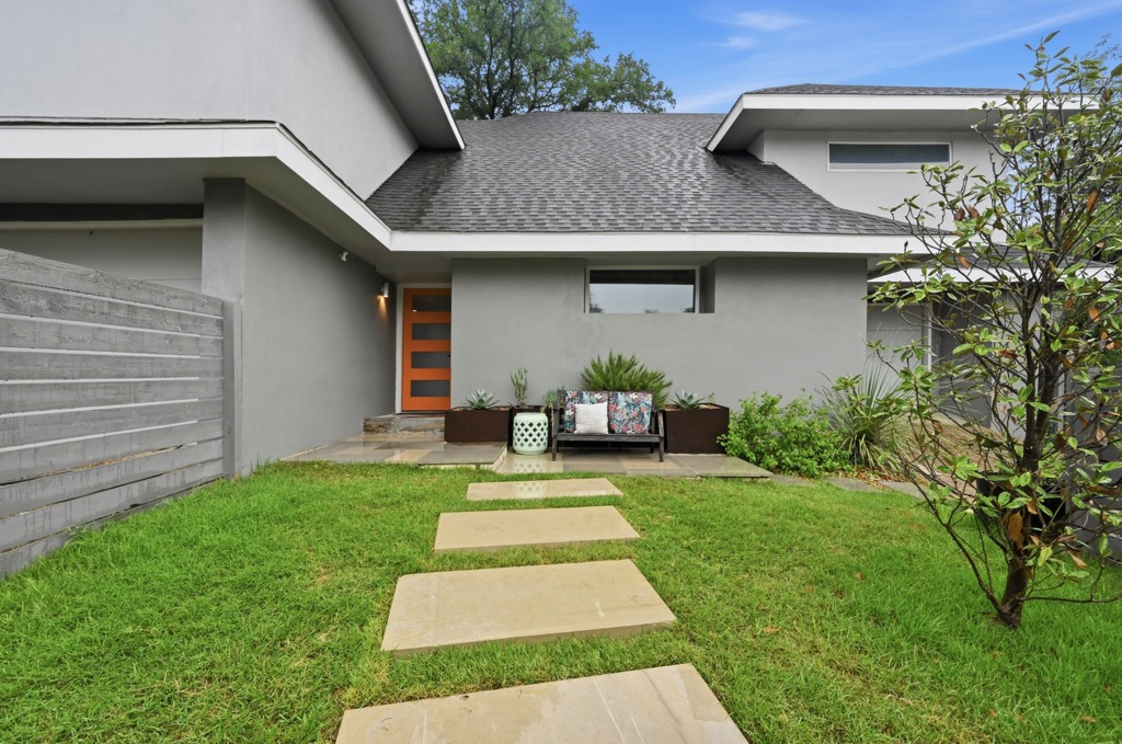 2101 Airole Way, Unit B Austin, TX 78704 - Photo 3 of 28 a front view of a house with a yard