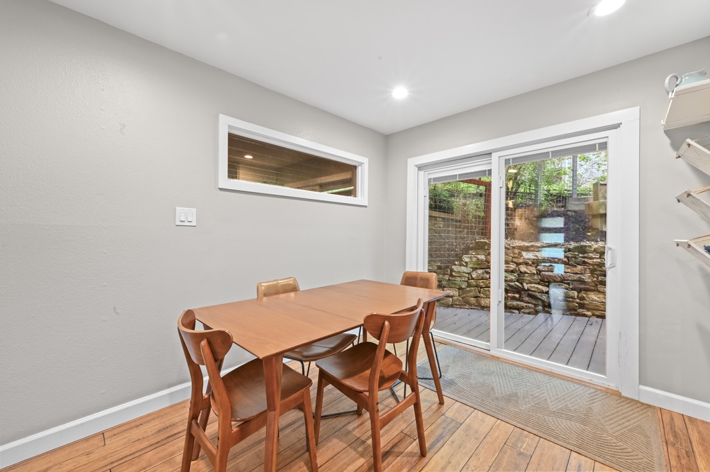 2101 Airole Way, Unit B Austin, TX 78704 - Photo 10 of 28 a view of a dining room with furniture and wooden floor