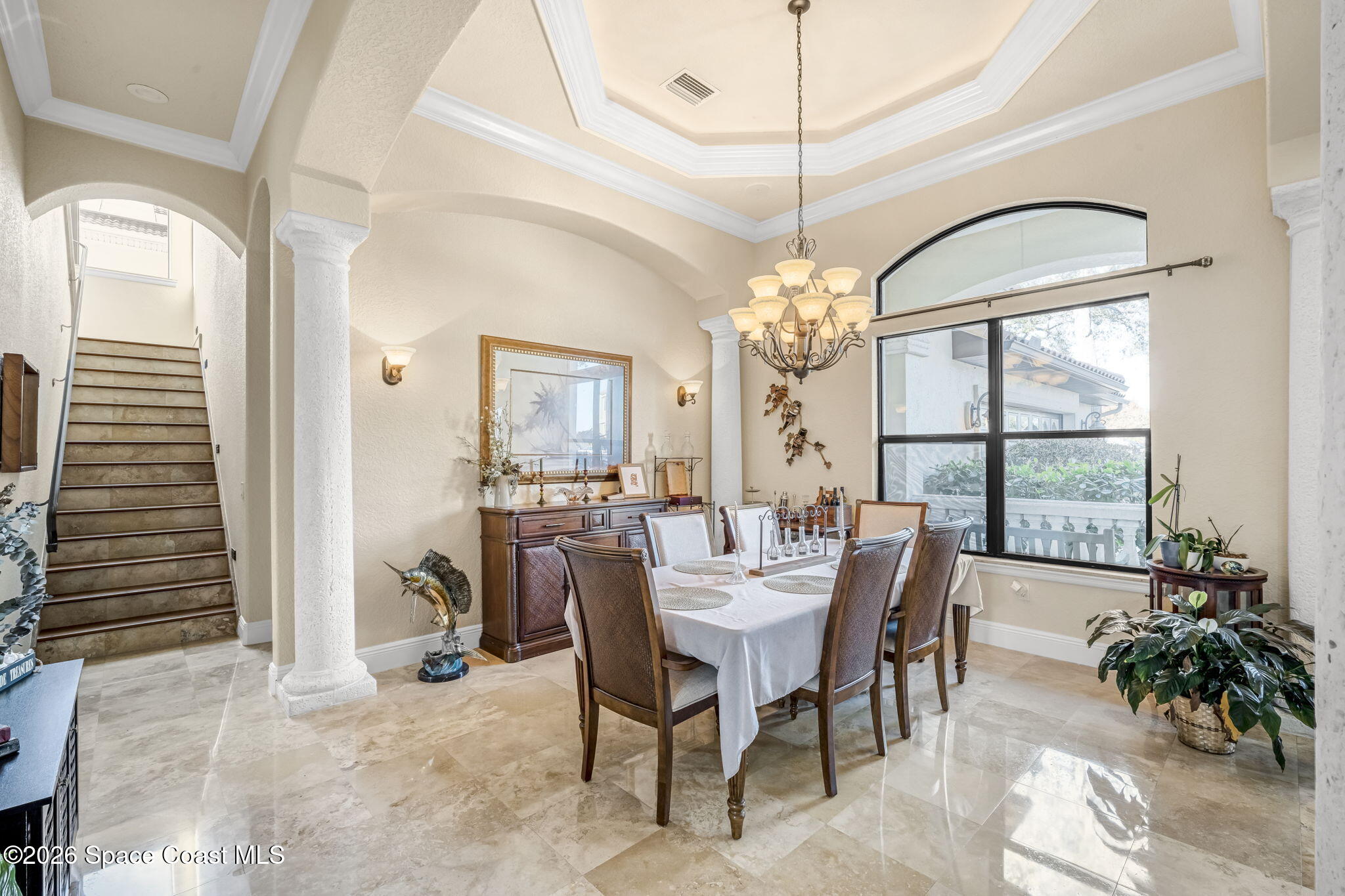 5454 Riveredge Drive Titusville, FL 32780 - Photo 11 of 70 a dining room with furniture a chandelier and window