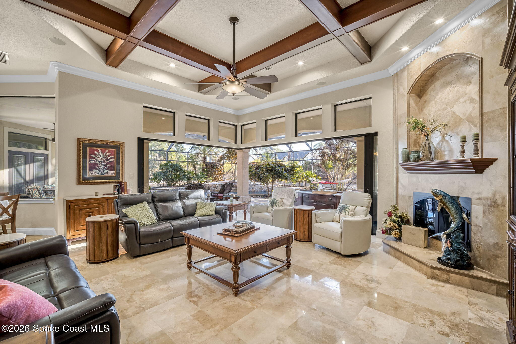 5454 Riveredge Drive Titusville, FL 32780 - Photo 14 of 70 a living room with furniture a chandelier and a flat screen tv