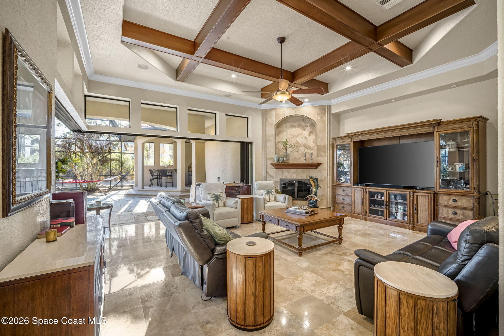5454 Riveredge Drive Titusville, FL 32780 - Photo 15 of 70 a living room with fireplace furniture and a flat screen tv