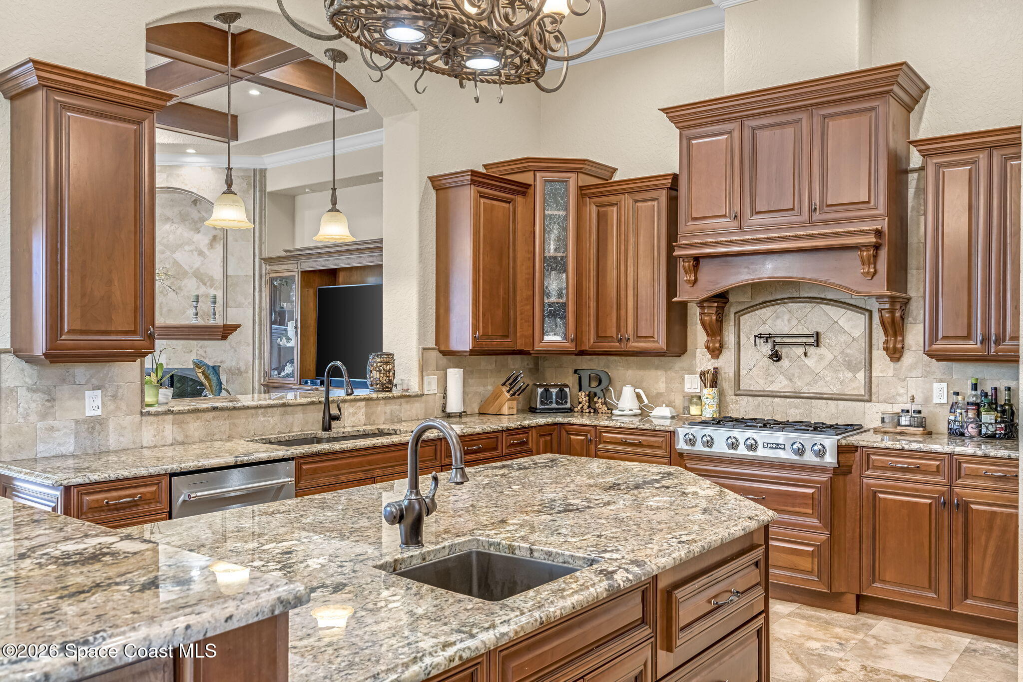 5454 Riveredge Drive Titusville, FL 32780 - Photo 23 of 70 a kitchen with stainless steel appliances granite countertop a sink stove and cabinets