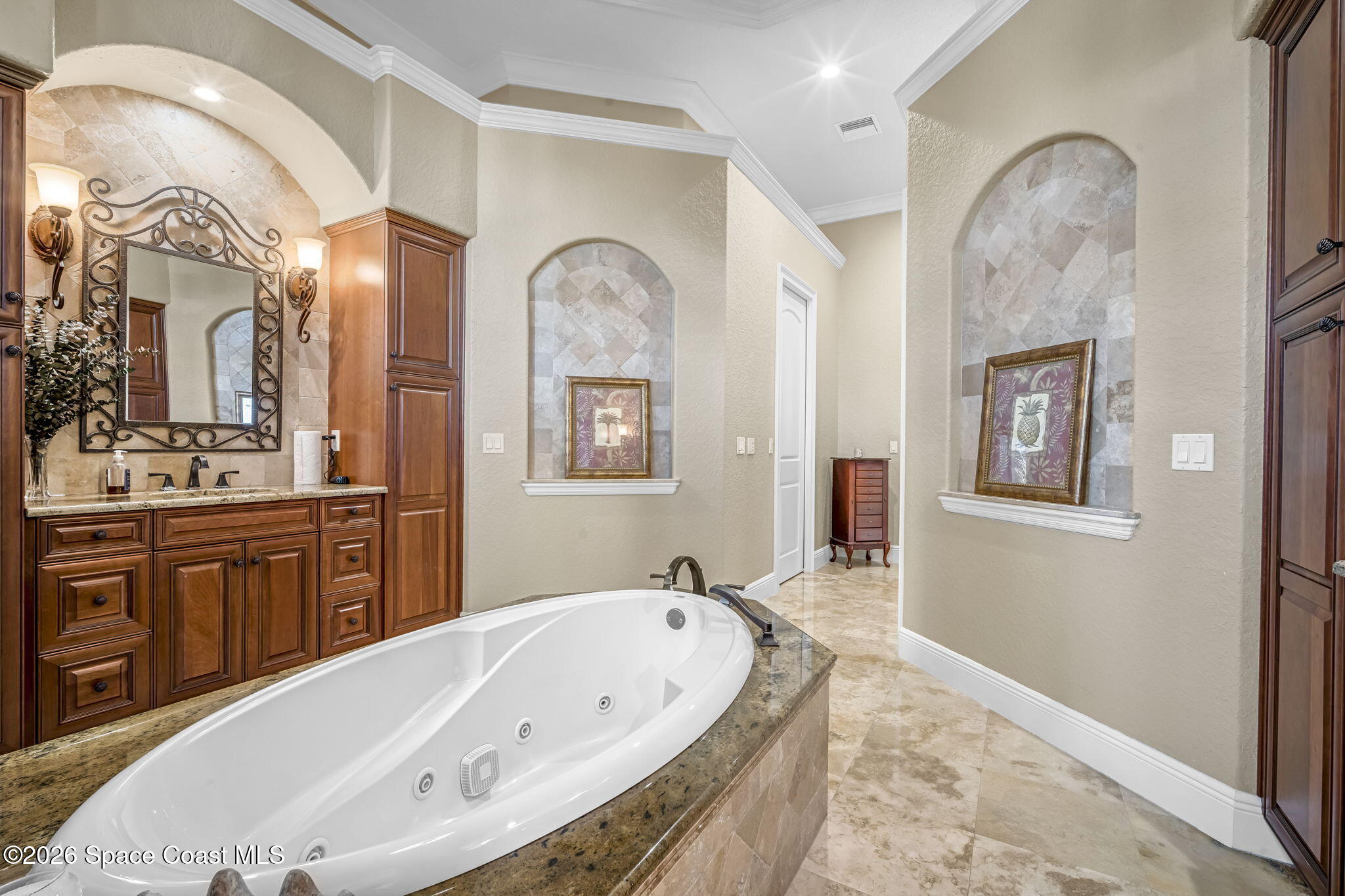 5454 Riveredge Drive Titusville, FL 32780 - Photo 31 of 70 a spacious bathroom with a tub double sink and a mirror