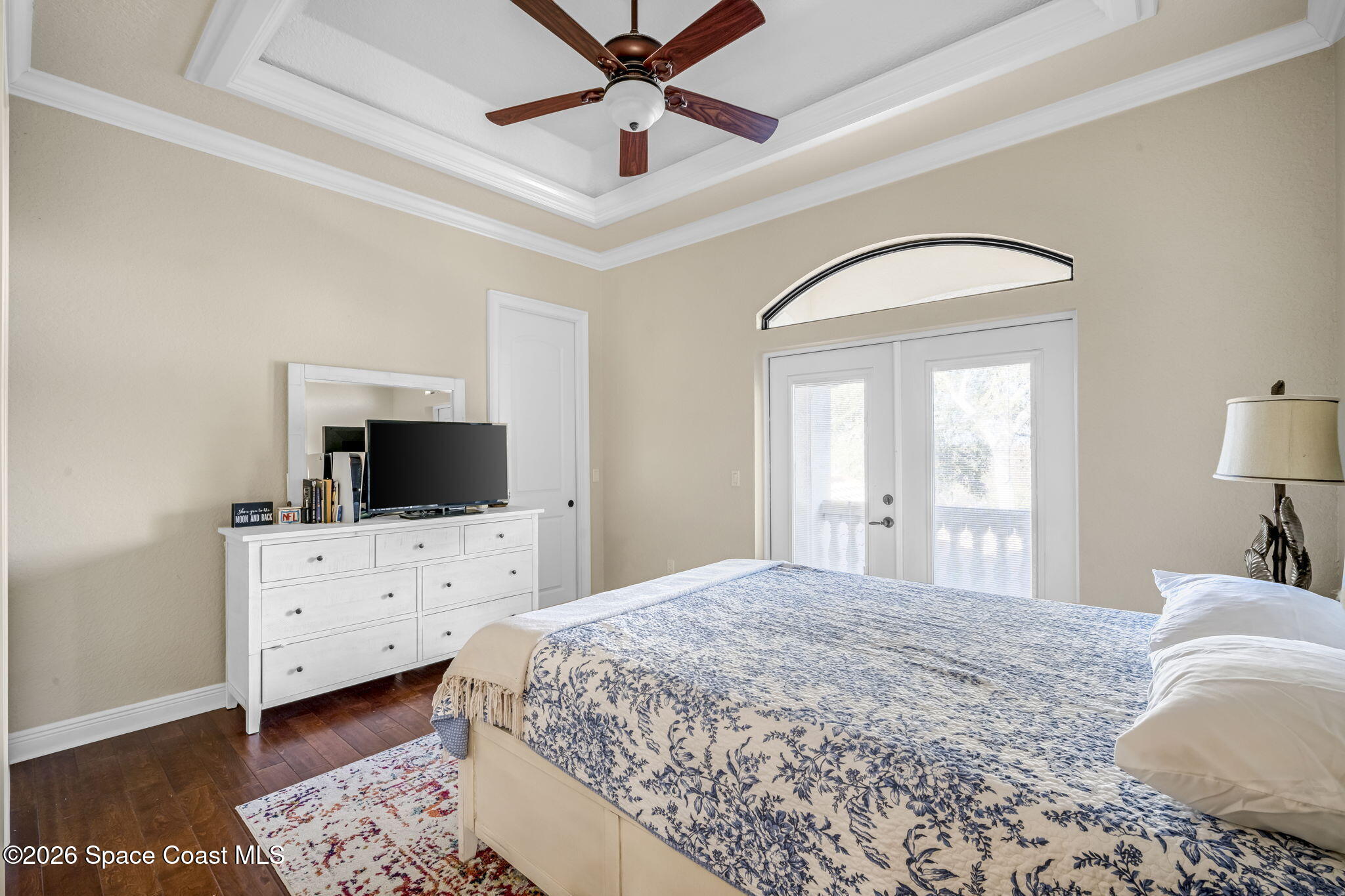 5454 Riveredge Drive Titusville, FL 32780 - Photo 36 of 70 a bedroom with a bed and a flat screen tv