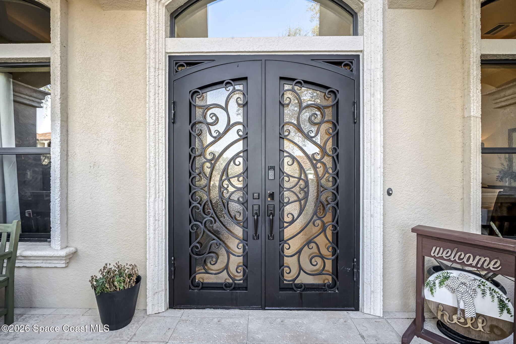 5454 Riveredge Drive Titusville, FL 32780 - Photo 4 of 70 a view of front door with wooden door