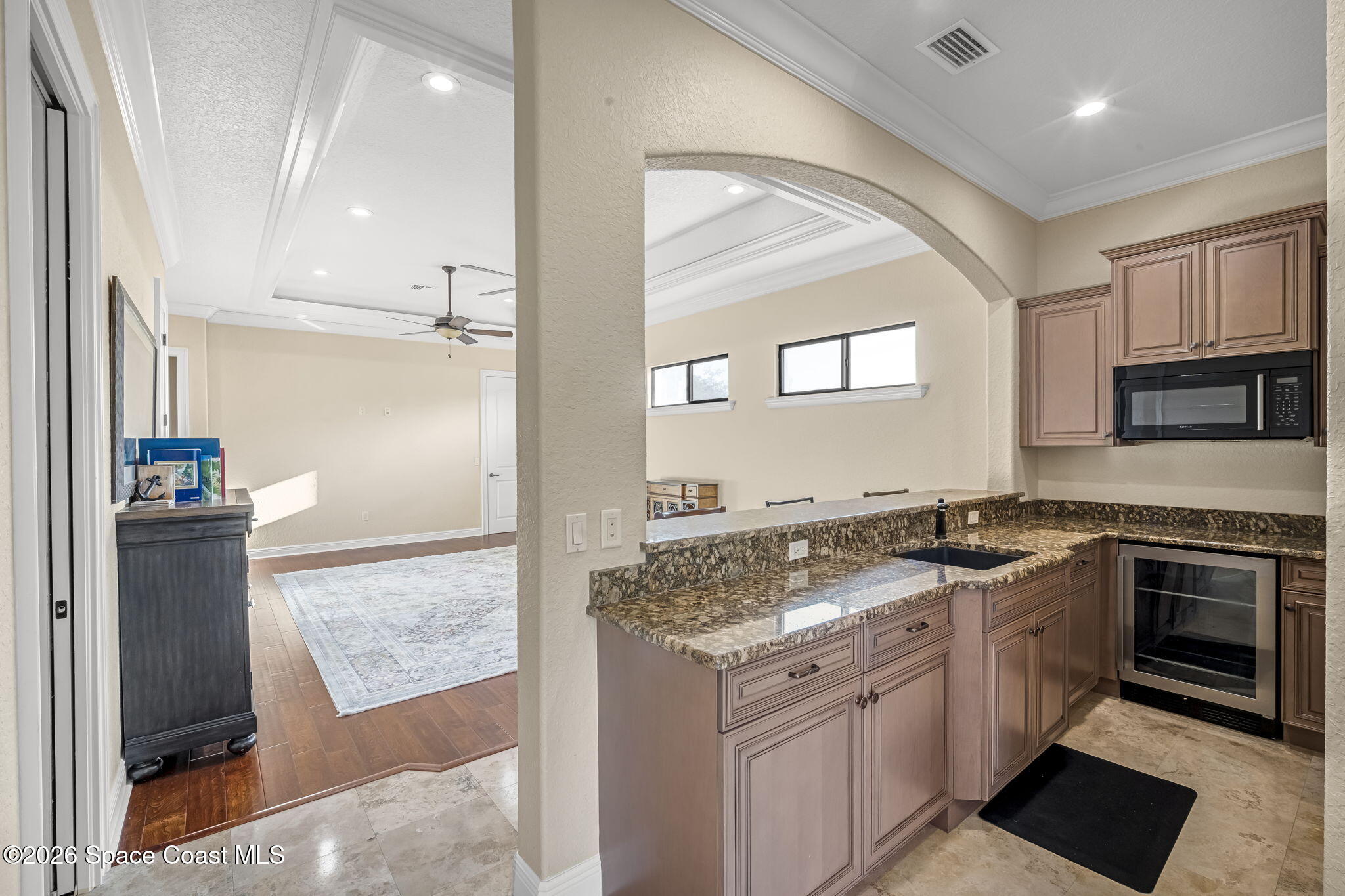 5454 Riveredge Drive Titusville, FL 32780 - Photo 41 of 70 a kitchen with stainless steel appliances granite countertop a stove a sink and a refrigerator